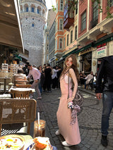 Mono Long Dress in pink on a busy street