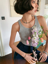 U-Neck Rib Tank in gray holding flowers