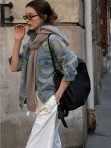Washed Denim Jacket with wide white pants on a city sidewalk